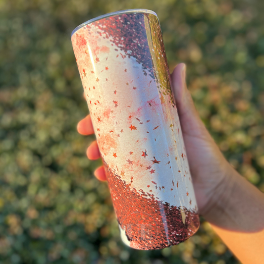 A 20oz fatty stainless steel tumbler with red stars, sparkles, and cheetah prints.  This tumbler includes a silicone bottom, leakproof top, metal straw and straw cleaner. Front view with a customizable option.